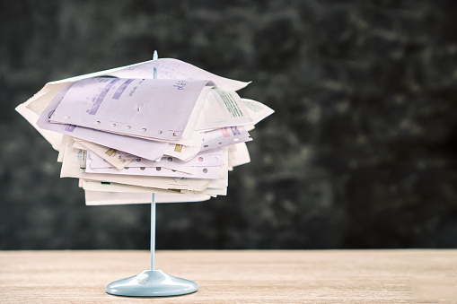overdue-concept-with-stack-of-unpaid-bills-on-tablefinal-reminder-letter