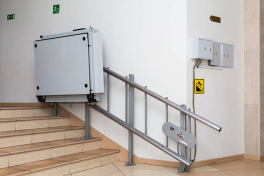 Stair lift for the disabled. Stairs of public building.