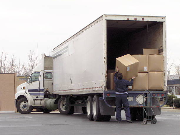 man-off-loads-boxes-from-an-18-wheeler