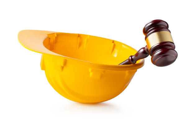 law-and-work-concept-judge-gavel-in-hardhat-isolated-on-white-background
